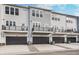 Modern townhomes featuring private garages, balconies, and contemporary design at 14539 Hanford Ln, Carmel, IN 46032