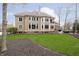 Spacious backyard with well-maintained lawn, mature trees and large patio at 14577 Faucet Ln, Fishers, IN 46040