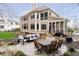 Backyard patio with outdoor seating, dining table and manicured landscaping at 14577 Faucet Ln, Fishers, IN 46040