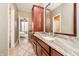 Spacious bathroom features a granite countertop vanity with a large mirror and cherry wood cabinets at 14577 Faucet Ln, Fishers, IN 46040