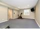 Basement gym with wall mounted television, stationary bike and neutral paint at 14577 Faucet Ln, Fishers, IN 46040