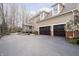 Spacious two-car garage, screened porch, and manicured landscaping enhance the home's curb appeal at 14577 Faucet Ln, Fishers, IN 46040