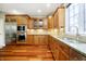Bright kitchen boasts stainless steel appliances, including refrigerator, microwave, and under cabinet lighting at 14577 Faucet Ln, Fishers, IN 46040