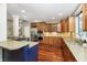 Well-appointed kitchen with stainless steel appliances, custom cabinets, and granite countertops at 14577 Faucet Ln, Fishers, IN 46040