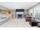 Comfortable living room with a fireplace, plush seating, and large windows at 14577 Faucet Ln, Fishers, IN 46040
