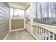 Cozy porch with wood flooring, railing, and views of the surrounding landscape and neighborhood at 14577 Faucet Ln, Fishers, IN 46040