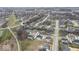 Aerial view of a community showcasing the layout, landscaping, and nearby ponds at 14818 Autumn View Way, Fishers, IN 46037