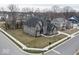 An aerial view displaying the spacious home with a well-kept lawn and the surrounding neighborhood at 14818 Autumn View Way, Fishers, IN 46037