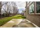 View of the backyard showing a concrete patio and green space extending to a line of trees at 14818 Autumn View Way, Fishers, IN 46037