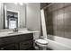Bathroom featuring a shower-tub combo, toilet, and vanity, offering a functional and stylish space at 14818 Autumn View Way, Fishers, IN 46037