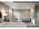 Spacious bedroom featuring neutral tones, comfortable seating area, and plush carpet, creating a relaxing retreat at 14818 Autumn View Way, Fishers, IN 46037