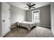 Bright bedroom with a comfortable platform bed near a window, offering a cozy and serene space with natural light at 14818 Autumn View Way, Fishers, IN 46037