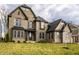 Lovely brick home with a manicured lawn, featuring multiple windows and a covered entrance at 14818 Autumn View Way, Fishers, IN 46037