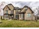 Charming, two-story brick home with beautiful landscaping and a well-maintained front lawn at 14818 Autumn View Way, Fishers, IN 46037