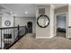 Upper hallway featuring decorative mirror, modern railing, and well-lit access to multiple rooms at 14818 Autumn View Way, Fishers, IN 46037