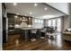 Well-lit kitchen with a central island, stainless steel appliances, and an adjacent dining area at 14818 Autumn View Way, Fishers, IN 46037