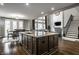 Open concept showcases a large kitchen island, dining area, and living room creating a welcoming atmosphere at 14818 Autumn View Way, Fishers, IN 46037