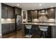Beautiful kitchen featuring dark cabinets, a large island, and stainless steel appliances at 14818 Autumn View Way, Fishers, IN 46037