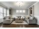 Elegant living room featuring sophisticated lighting, matching sofas, and a decorative rug at 14818 Autumn View Way, Fishers, IN 46037