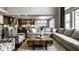 Open concept living room with a large sectional sofa that flows into kitchen with an island and dining area at 14818 Autumn View Way, Fishers, IN 46037