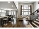Open living space with a kitchen island, dining area, and living room featuring large windows at 14818 Autumn View Way, Fishers, IN 46037