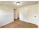 Spacious bedroom featuring wood flooring, neutral paint, and base molding throughout at 1518 Lawton Ave, Indianapolis, IN 46203