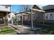Backyard space with a wooden pergola and greenery at 1521 Pleasant St, Indianapolis, IN 46203
