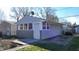 Backyard view of a small grey-stone shed with window at 1521 Pleasant St, Indianapolis, IN 46203
