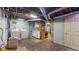 Unfinished basement with washer/dryer, utility sink, and laundry area at 1521 Pleasant St, Indianapolis, IN 46203
