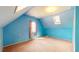 Bright bedroom featuring blue walls, carpeted floors, and a skylight at 1521 Pleasant St, Indianapolis, IN 46203