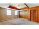 Spacious bedroom with natural wood paneled accent wall and closet at 1521 Pleasant St, Indianapolis, IN 46203