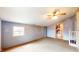 This bonus room has carpet, shiplap, and a small window at 1521 Pleasant St, Indianapolis, IN 46203