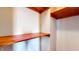The closet contains simple wooden shelves at 1521 Pleasant St, Indianapolis, IN 46203