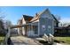 Charming two-story home with a covered parking area and a well-maintained front yard at 1521 Pleasant St, Indianapolis, IN 46203