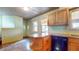 Well-lit kitchen featuring linoleum flooring, wood cabinets and countertop space at 1521 Pleasant St, Indianapolis, IN 46203