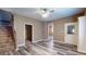 The living room has hardwood floors and staircase access at 1521 Pleasant St, Indianapolis, IN 46203
