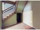 Carpeted staircase and landing area with access to basement or storage at 1521 Pleasant St, Indianapolis, IN 46203