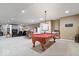 Large basement includes a pool table, wet bar, and seating area at 17279 Crescent Moon Dr, Noblesville, IN 46060