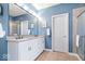 Bright bathroom featuring double sinks, vanity with stone countertop, and walk-in shower at 17279 Crescent Moon Dr, Noblesville, IN 46060