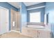 Bright bathroom with a large soaking tub and separate shower at 17279 Crescent Moon Dr, Noblesville, IN 46060