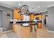 Modern kitchen with a central island, granite countertops, and stainless steel appliances and a hanging pot rack at 17279 Crescent Moon Dr, Noblesville, IN 46060