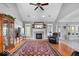 Bright and airy living room with a fireplace, large windows, and hardwood floors under a patterned rug at 17279 Crescent Moon Dr, Noblesville, IN 46060