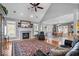 Spacious living room featuring a cozy fireplace, high ceilings, and an open layout with hardwood floors at 17279 Crescent Moon Dr, Noblesville, IN 46060