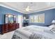 Spacious main bedroom featuring a bed with a quilt, ample natural light, and a view of the exterior at 17279 Crescent Moon Dr, Noblesville, IN 46060