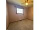 Small bedroom featuring a ceiling fan, carpeted floors, and a window with a view at 2115 Leonard Rd, Martinsville, IN 46151