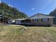 Ranch home with brick exterior, attached garage, and white-railed porch, set in a serene landscape at 2115 Leonard Rd, Martinsville, IN 46151