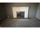Close-up of a white painted brick fireplace with dark gray accent wall at 2115 Leonard Rd, Martinsville, IN 46151
