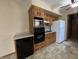 A functional kitchen with classic wood cabinetry, modern appliances, and durable countertops at 2115 Leonard Rd, Martinsville, IN 46151
