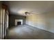 Spacious living room with neutral carpet, fireplace, and a ceiling fan at 2115 Leonard Rd, Martinsville, IN 46151