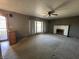 This image shows a living room featuring a fireplace and a large window offering natural light at 2115 Leonard Rd, Martinsville, IN 46151